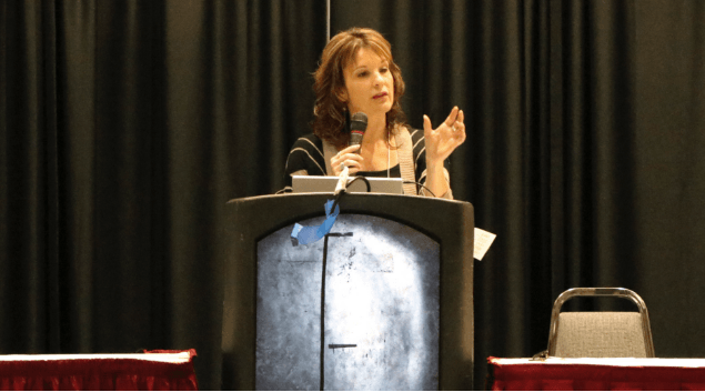 Woman speaking at a podium