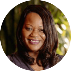 Image: Kimberly Johnson, a black woman with long brown hair smiles.