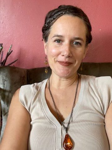 Image: Andrew Coltrin, white male with graying hair and glasses, smiling in his home office.